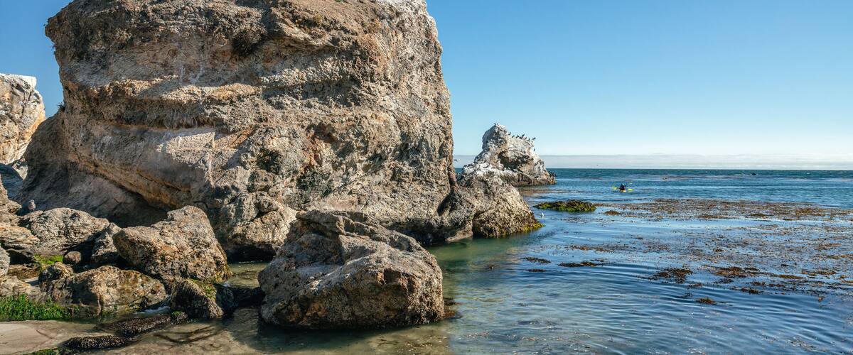 Sea kayaking. Exploring caves, arches, and rocks at Pismo Beach, California