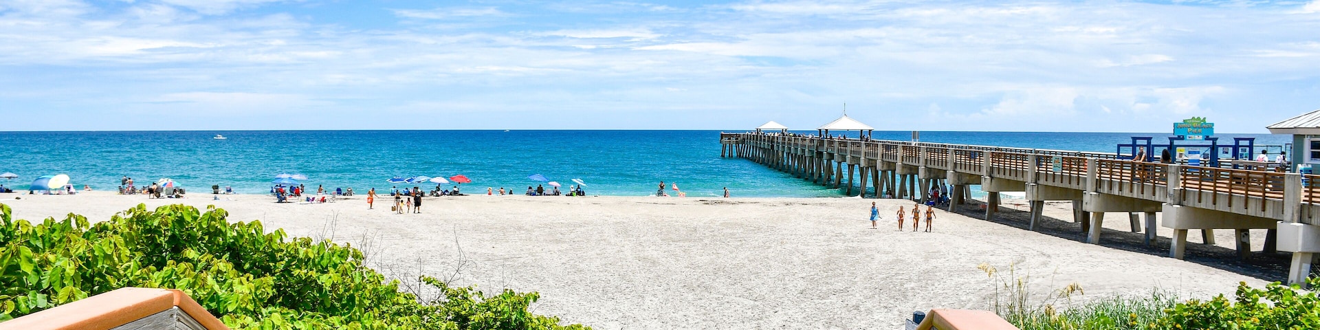 Boardwalk leading down to Juno Beach pier in Palm Beach County, Florida.