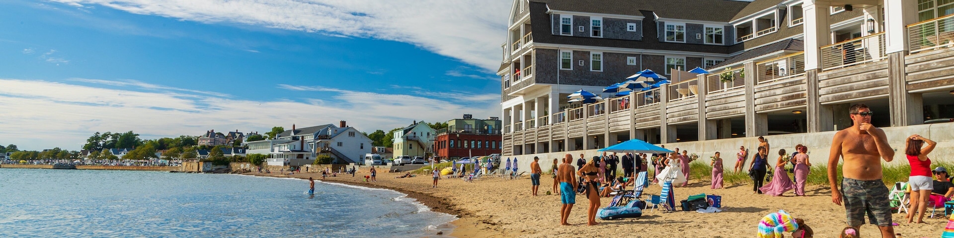 Pavilion Beach which includes a coastal town and a sandy beach