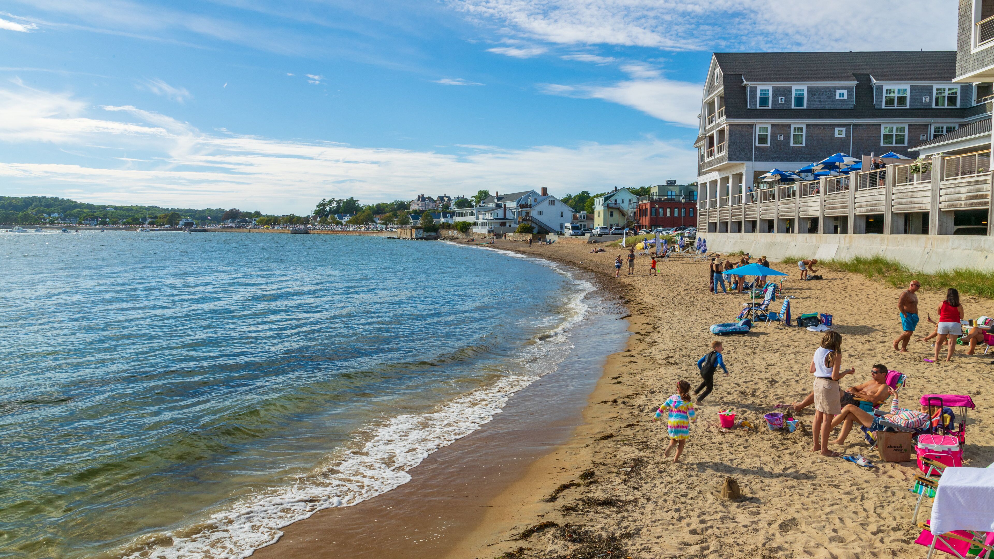 Pavilion Beach which includes a sandy beach and a coastal town