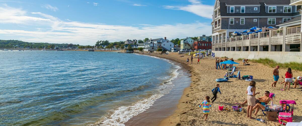 Pavilion Beach which includes a sandy beach and a coastal town