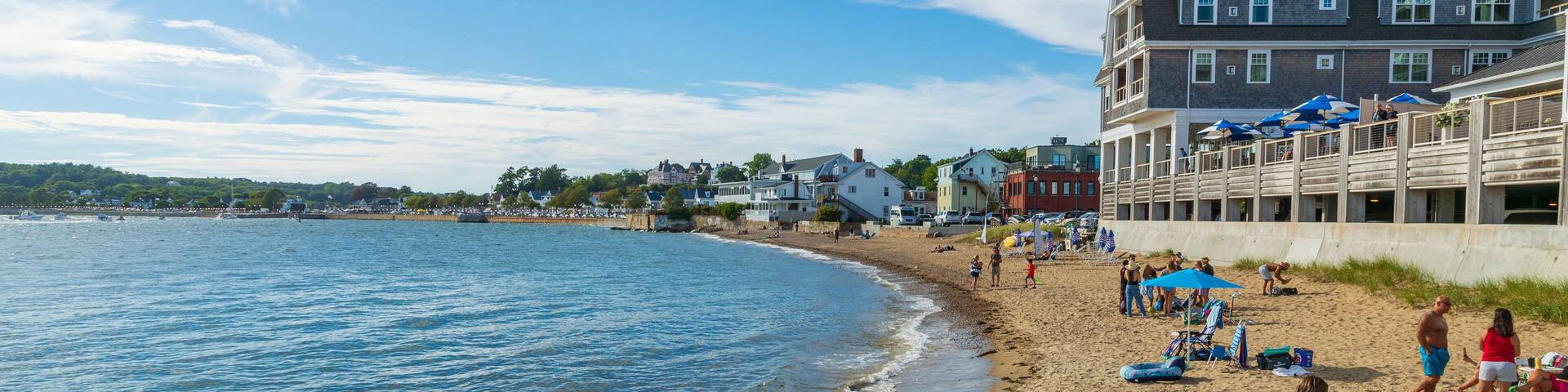 Pavilion Beach which includes a sandy beach and a coastal town