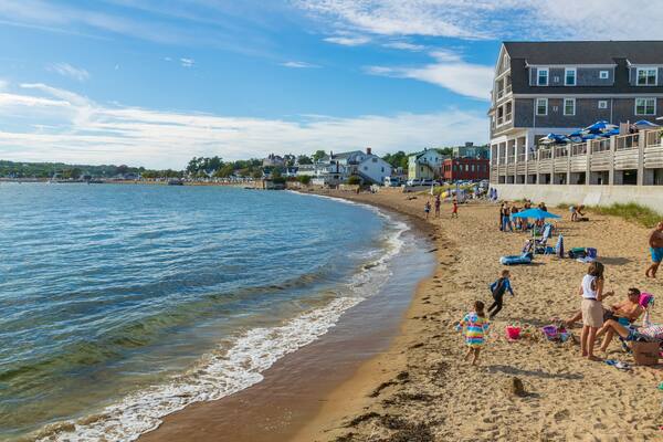 Pavilion Beach which includes a sandy beach and a coastal town