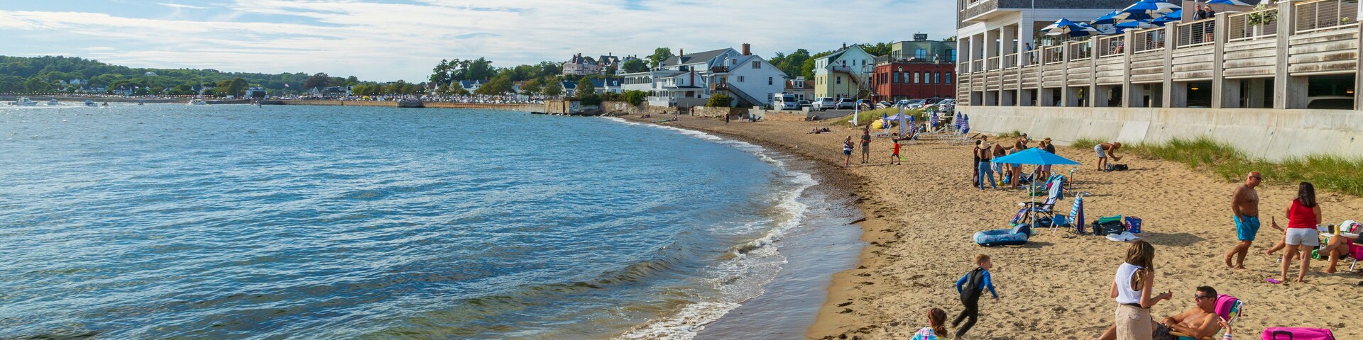 Pavilion Beach which includes a sandy beach and a coastal town