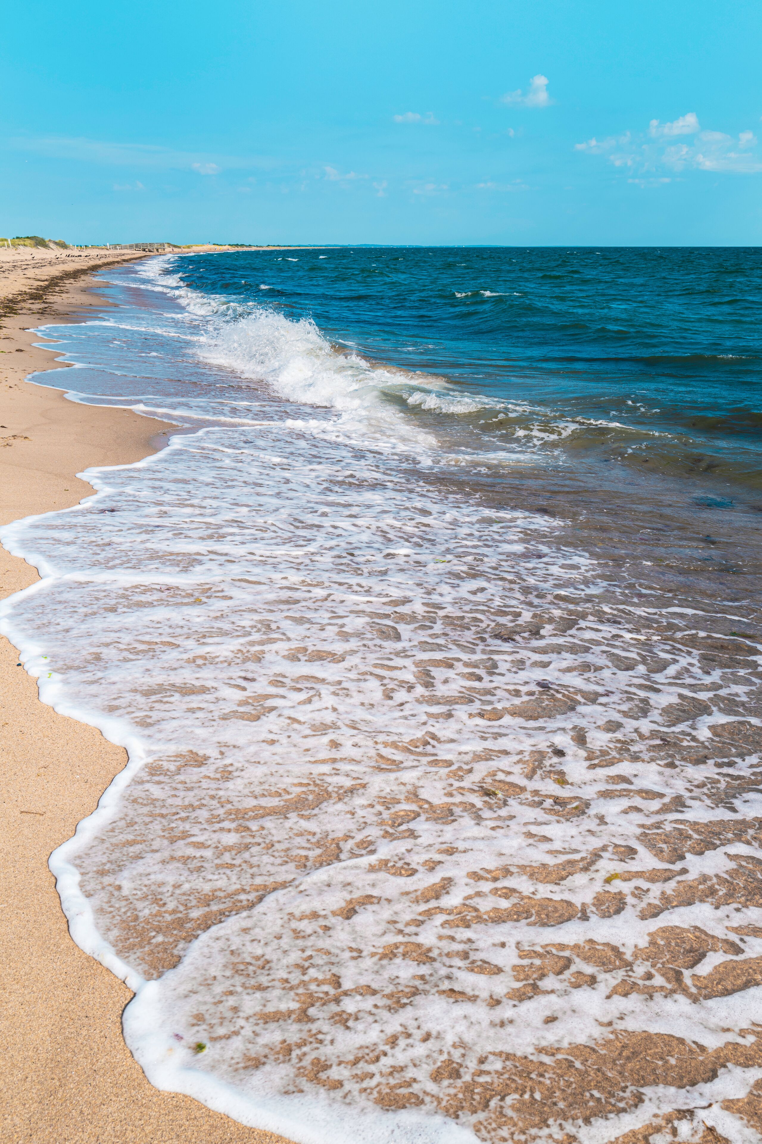 Seascape with white waves rolling in on the South Cape Beach in Mashpee, Massachusetts