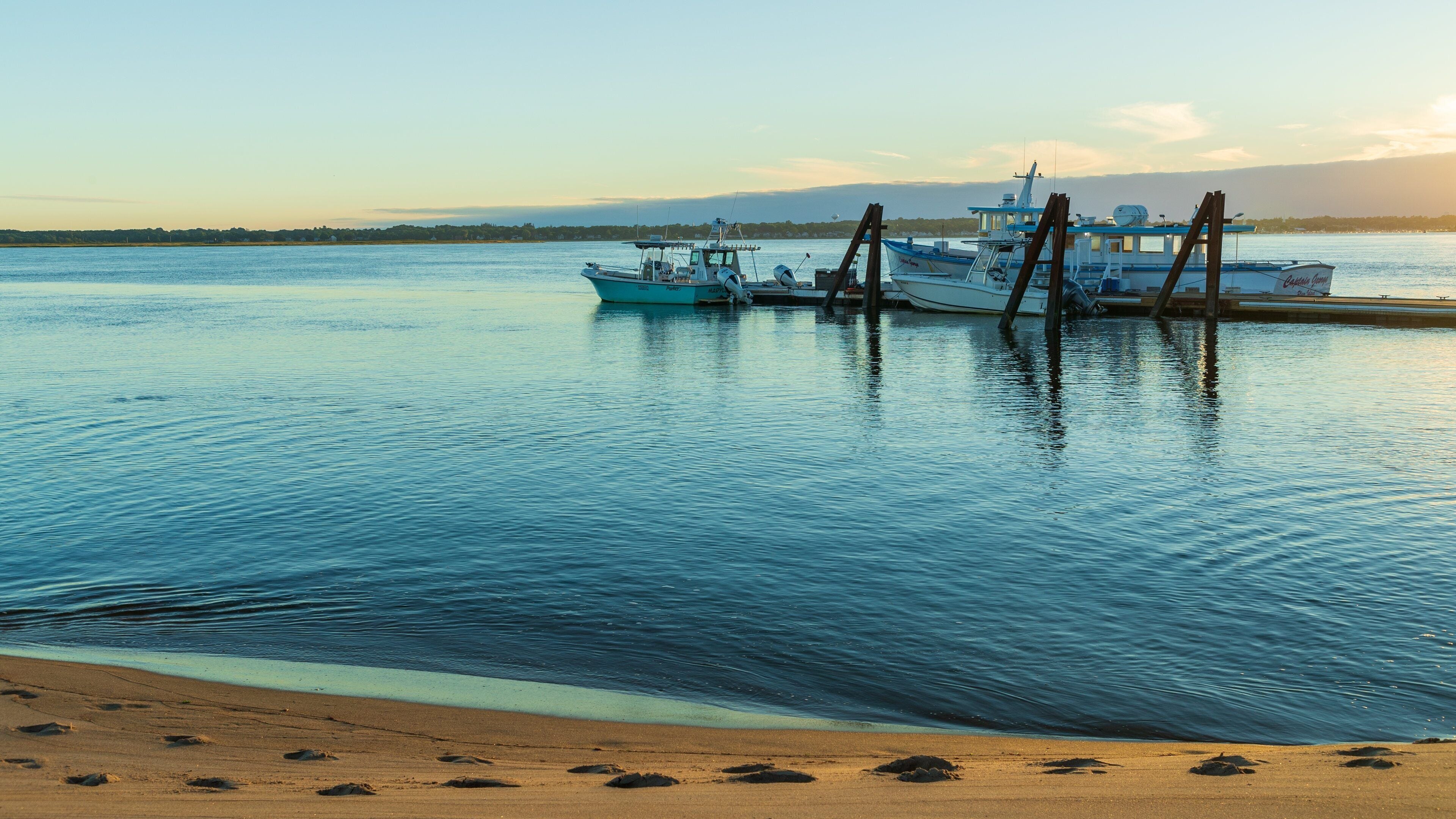 Plum Island Beach showing a sunset and a bay or harbor