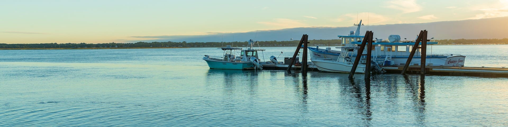 Plum Island Beach showing a sunset and a bay or harbor