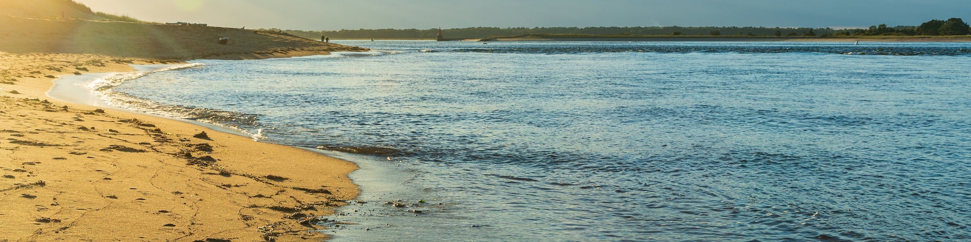 Plum Island Beach which includes a sandy beach, a sunset and general coastal views