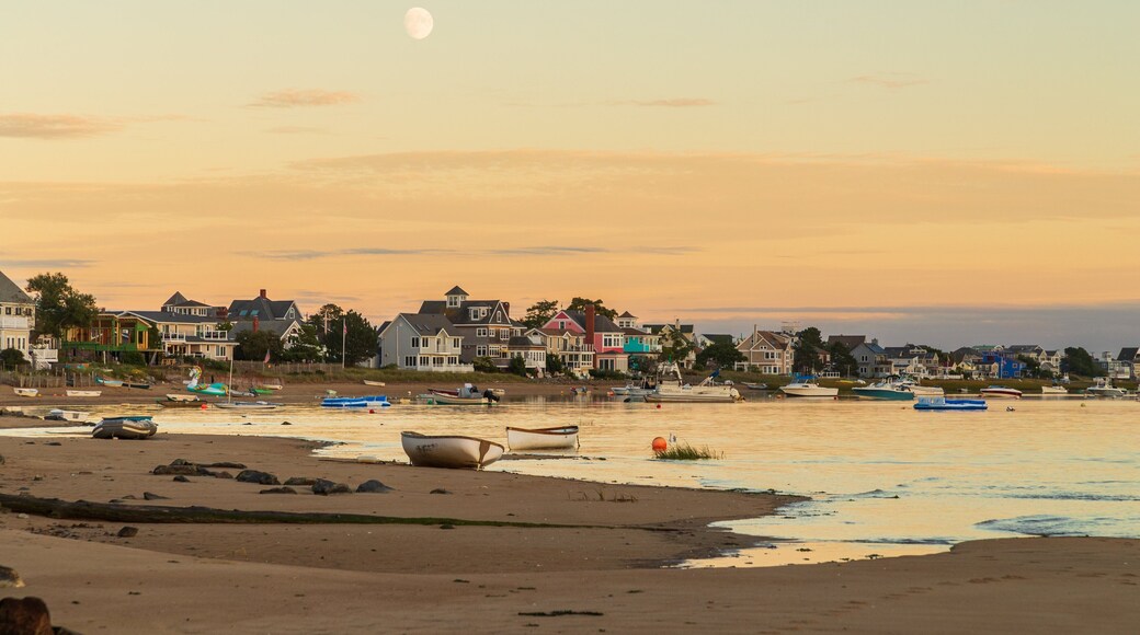 Plum Island Beach which includes a sunset, a sandy beach and a coastal town