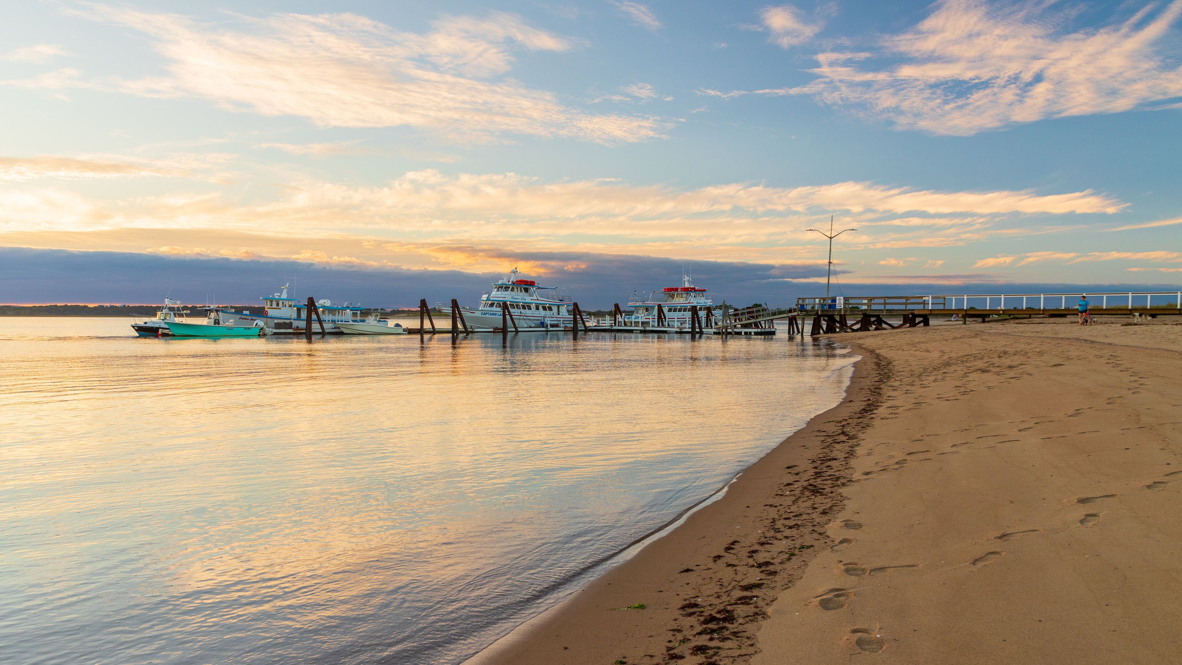 Plum Island Beach showing general coastal views, a sunset and a bay or harbor
