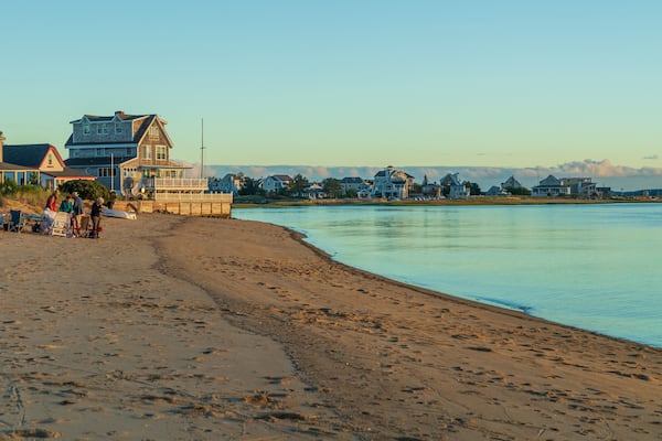 Plum Island Beach showing a sandy beach, a sunset and general coastal views