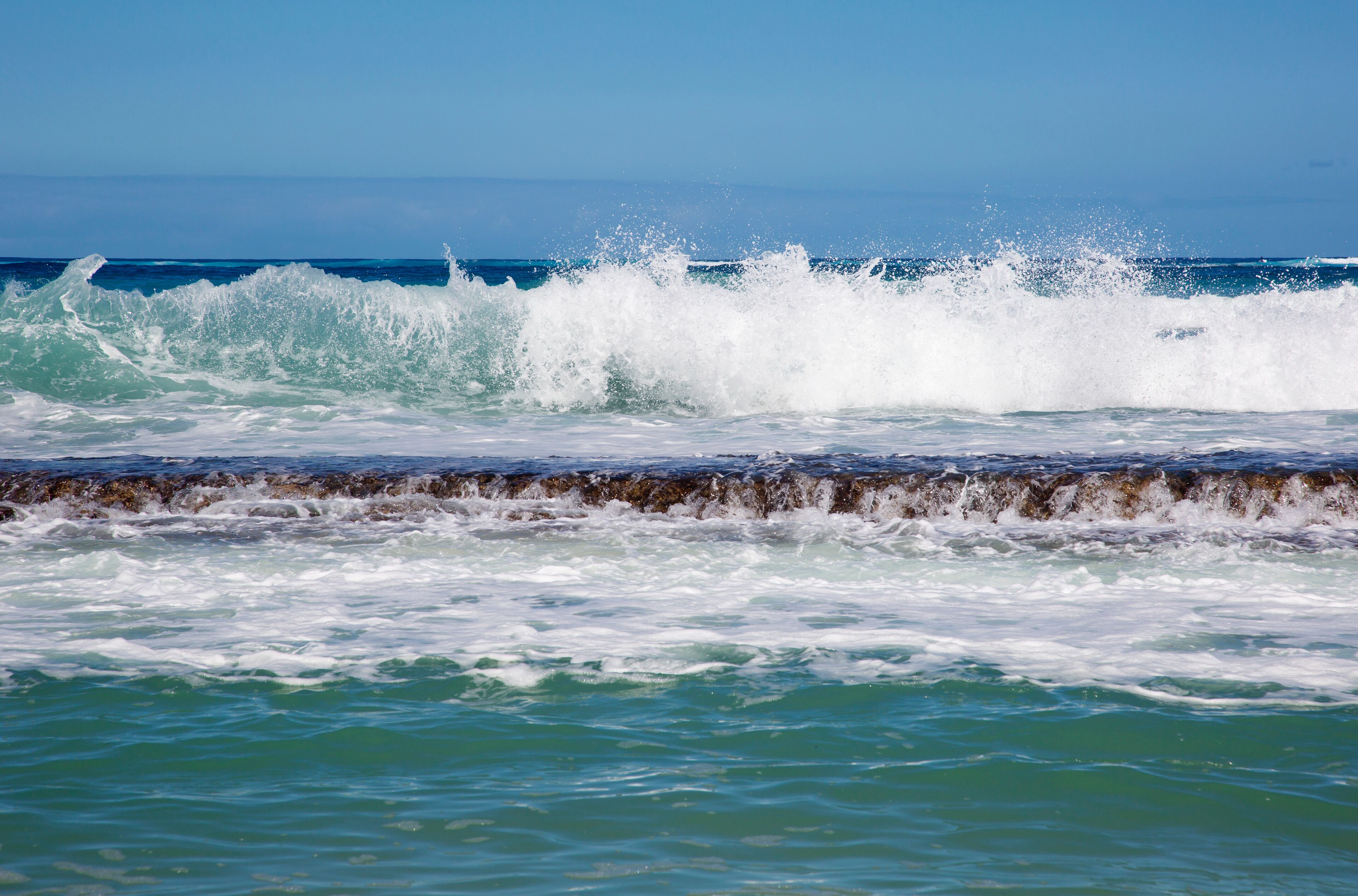 Close-up of the waves breaking on reef at Baby Beach, part of Baldwin Beach on the North Shore of Maui near Paia; Maui, Hawaii, United States of America