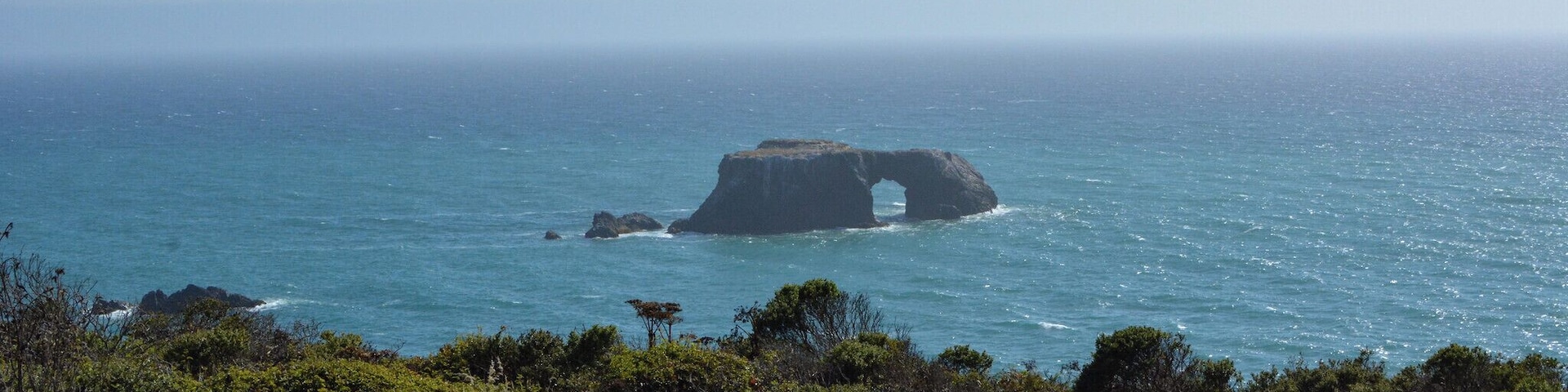 Beautiful view of an arched rock from the Blind Beach parking lot. Wait for the fog to clear! #aquatrove