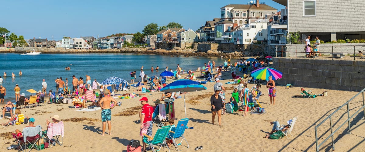 Front Beach which includes a beach, general coastal views and a coastal town