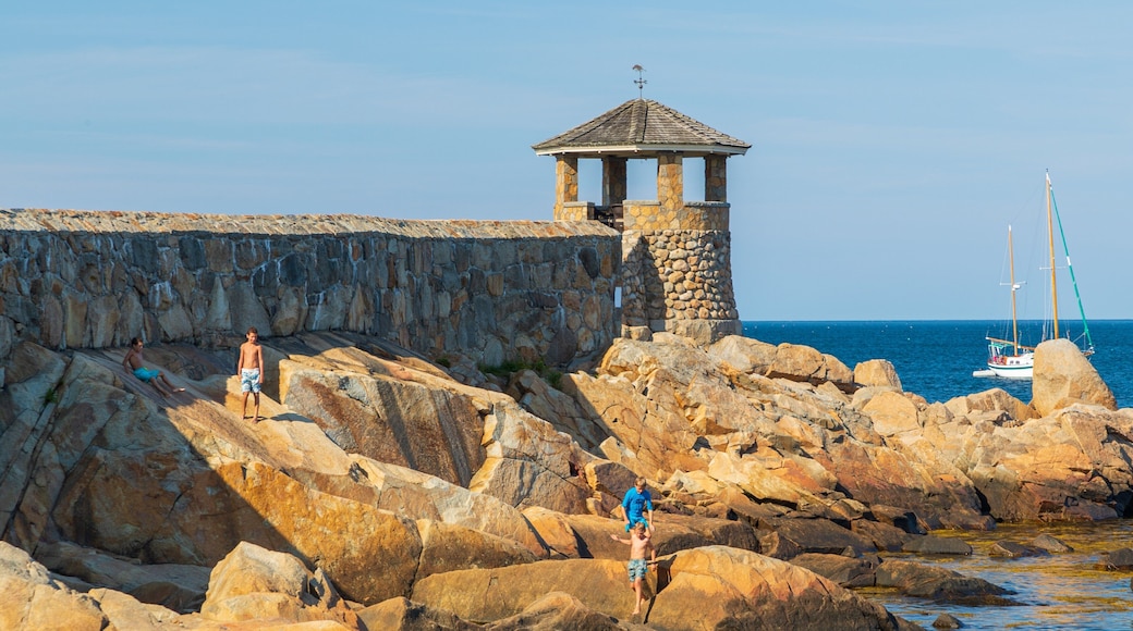 Front Beach which includes rocky coastline and general coastal views