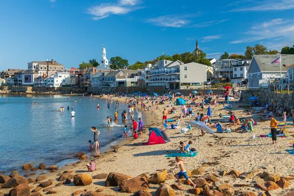 Front Beach featuring a sandy beach and a coastal town