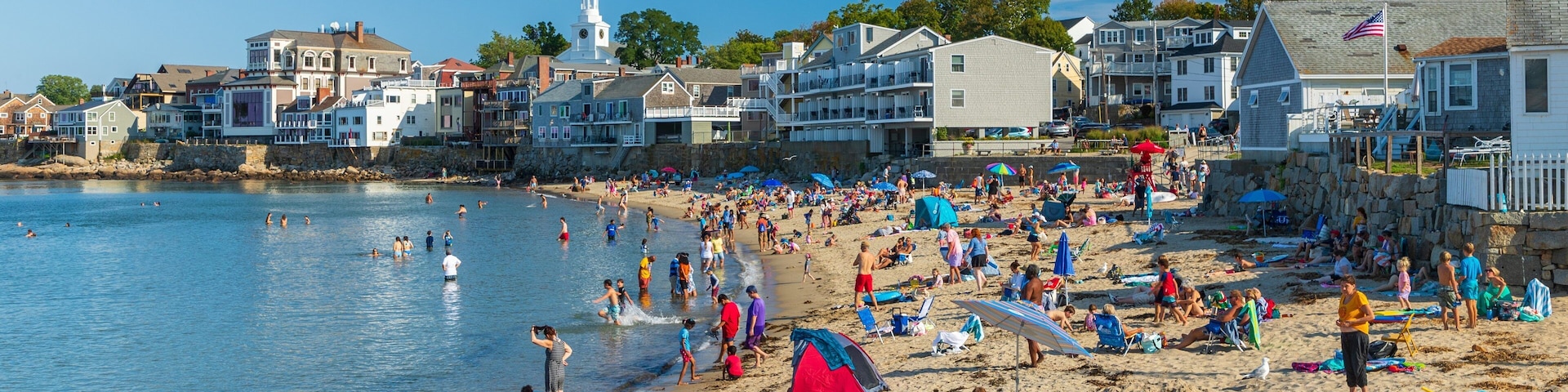 Front Beach featuring a sandy beach and a coastal town