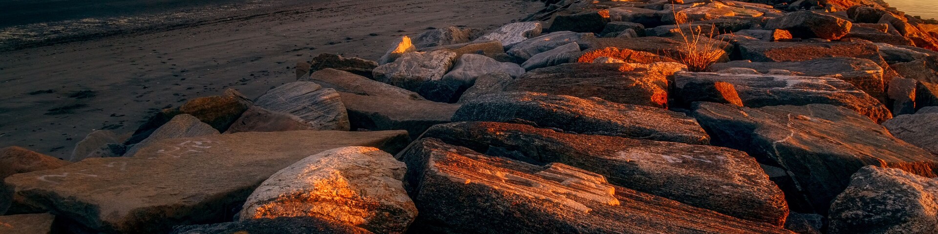 Sunset on the Breakwater at Seaside Park in Bridgeport, Connecticut, USA.