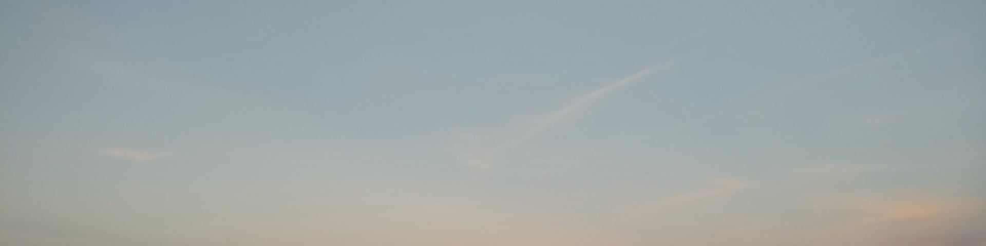 This beach is in Centennial Park in Evanston, IL
This picture was taken at sunset which was happening on the opposite side but I'm facing east here and you can see the sunset reflection on the horizon. It was perfect timing because water was very calm and it was hard to tell were skies connect with water on the horizon.