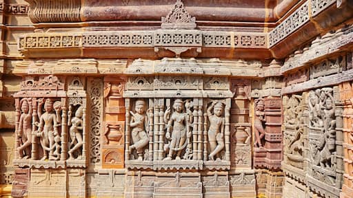 Carved panel of Hindu deities on Hatkeshwar Temple, Vadnagar, Mehsana, Gujarat, India.