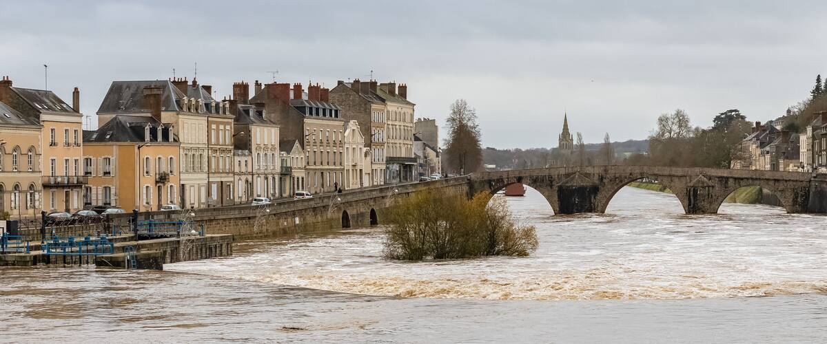 Laval, beautiful french city, panorama of the river and typical houses in the ancient center, downtown under the floods, the river in flood