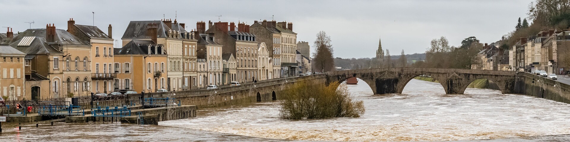 Laval, beautiful french city, panorama of the river and typical houses in the ancient center, downtown under the floods, the river in flood