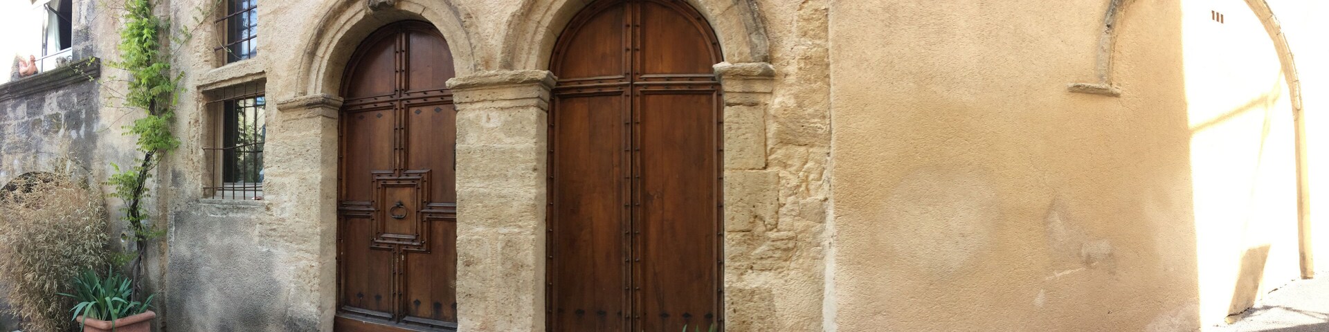 entrance of an ancient house with carved stones