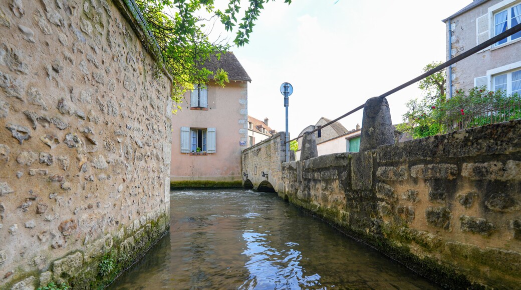River La Cléry flowing at the foot of the houses of Ferrière-en-Gâtinais in the French department of Loiret, Centre Val de Loire, France