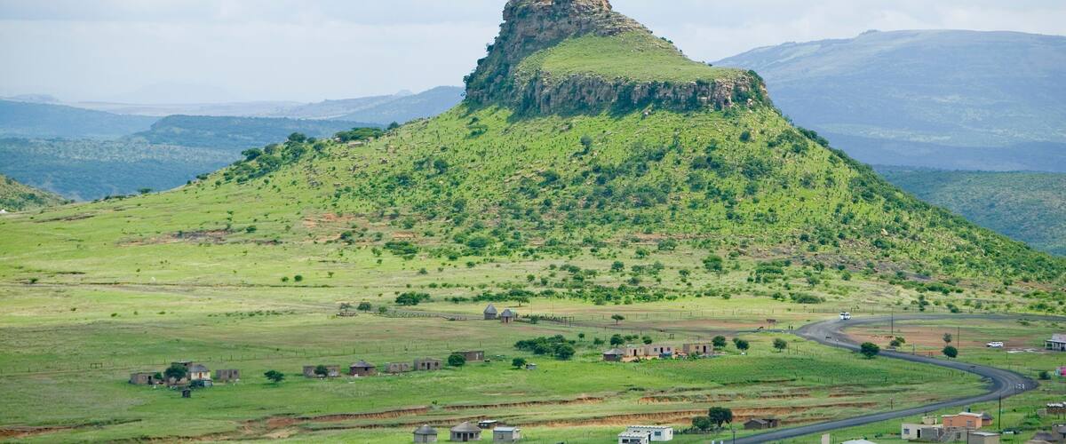 Sandlwana hill or Sphinx with village in foreground, the scene of the Anglo Zulu battle site of January 22, 1879. The great Battlefield of Isandlwana and the Oskarber, Zululand, northern Kwazulu Natal, South Africa