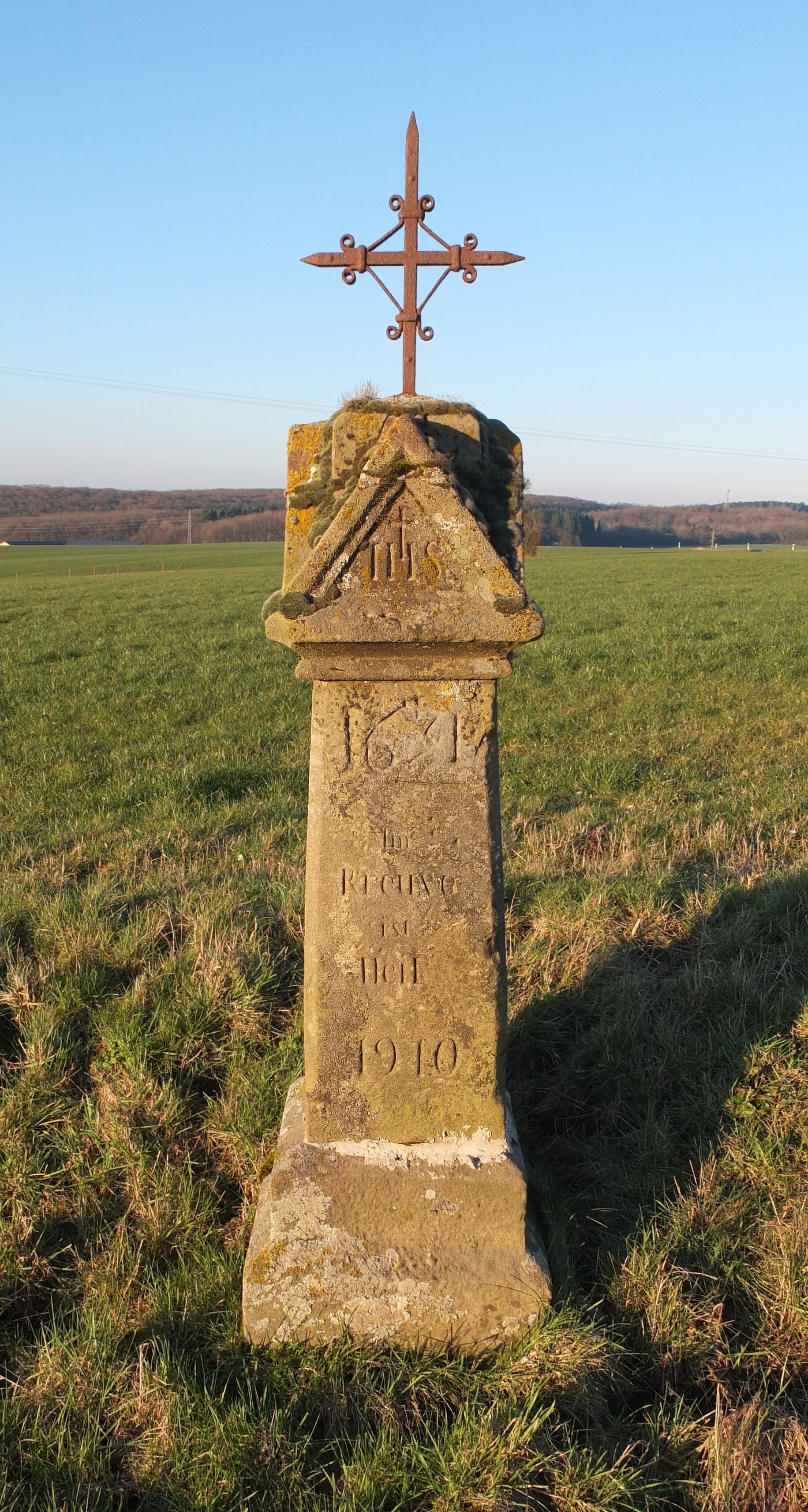 Wayside cross near Osweiler, Luxembourg, Inscription: "1631 - Im Kreuze ist Heil", restoration dated 1910.