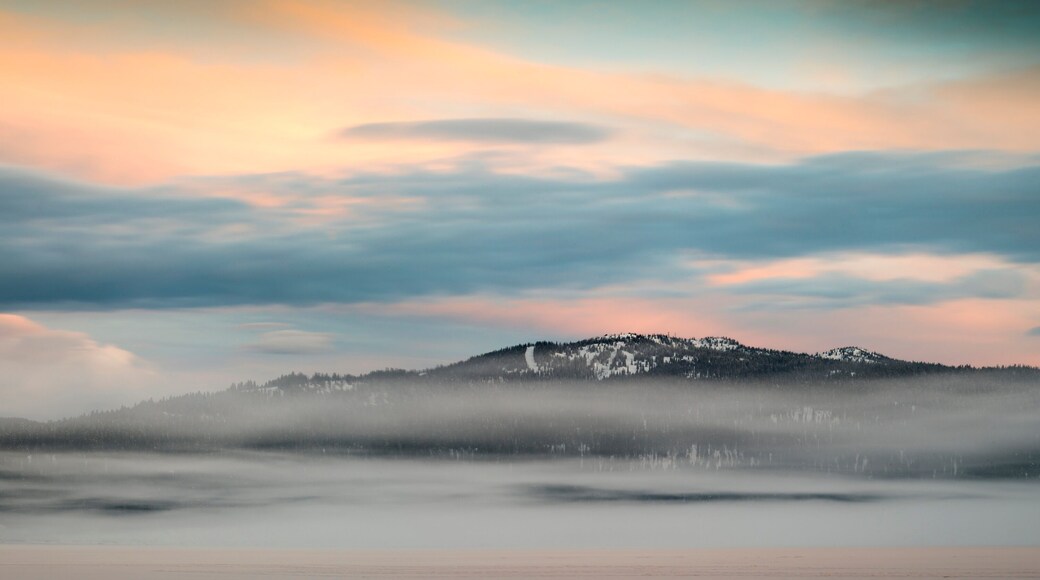 A pastel sunrise over a ski resort in winter