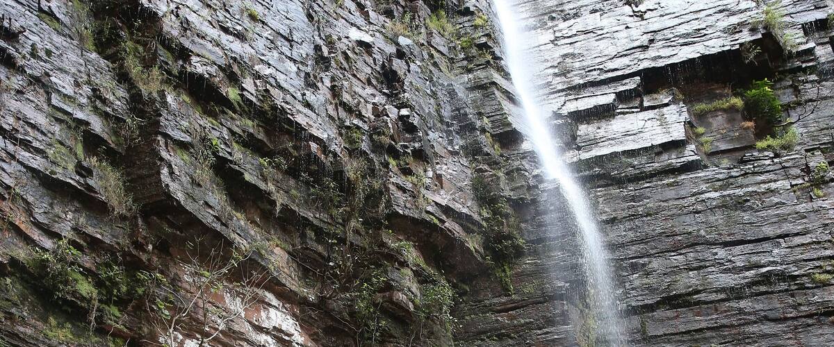 A waterfall cascading down a rocky cliff.