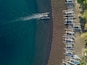 Indonesia, Bali, Amed, Aerial view of Jemeluk beach with banca boats