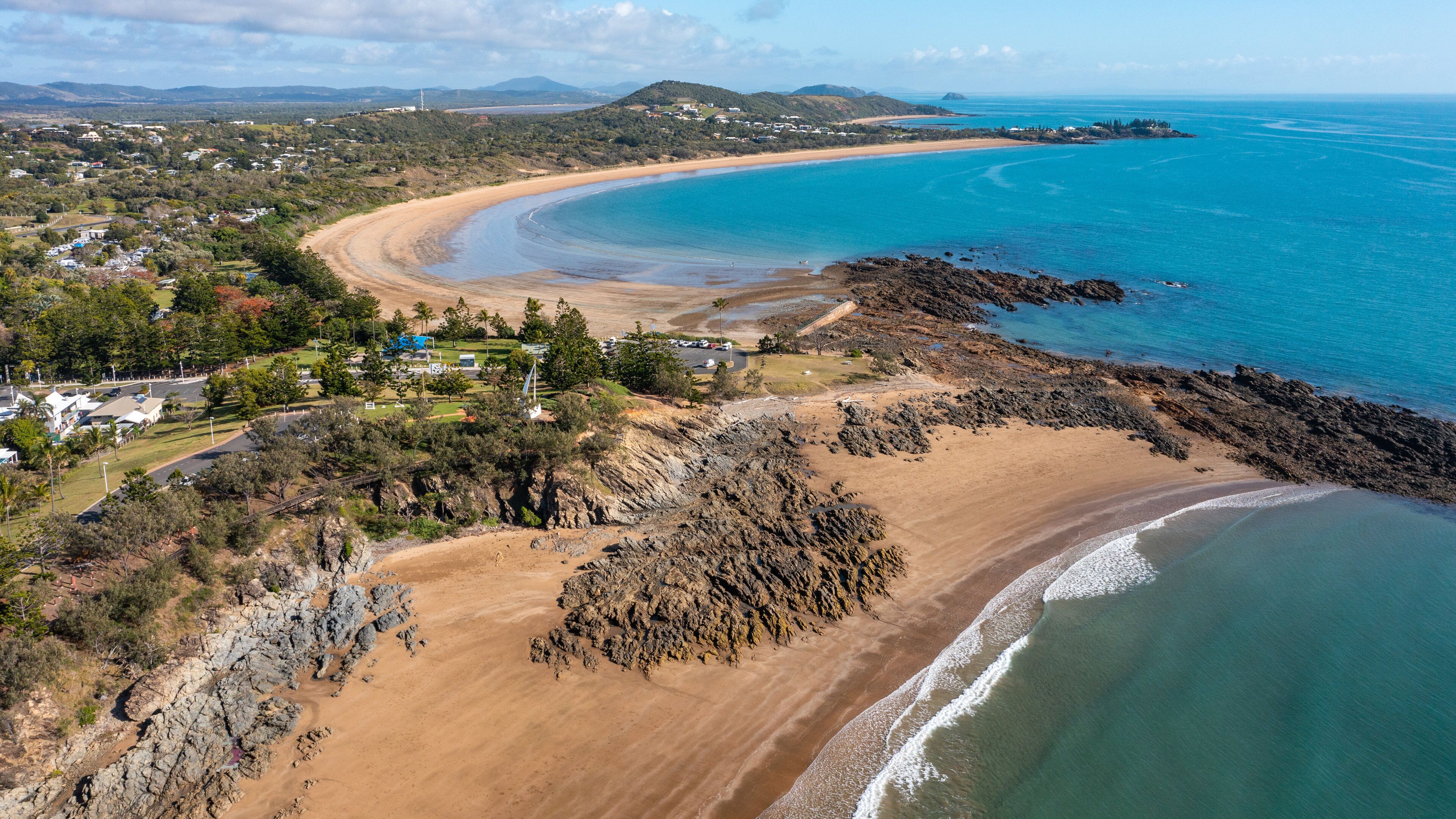 Emu Park Main Beach which includes a coastal town, general coastal views and landscape views