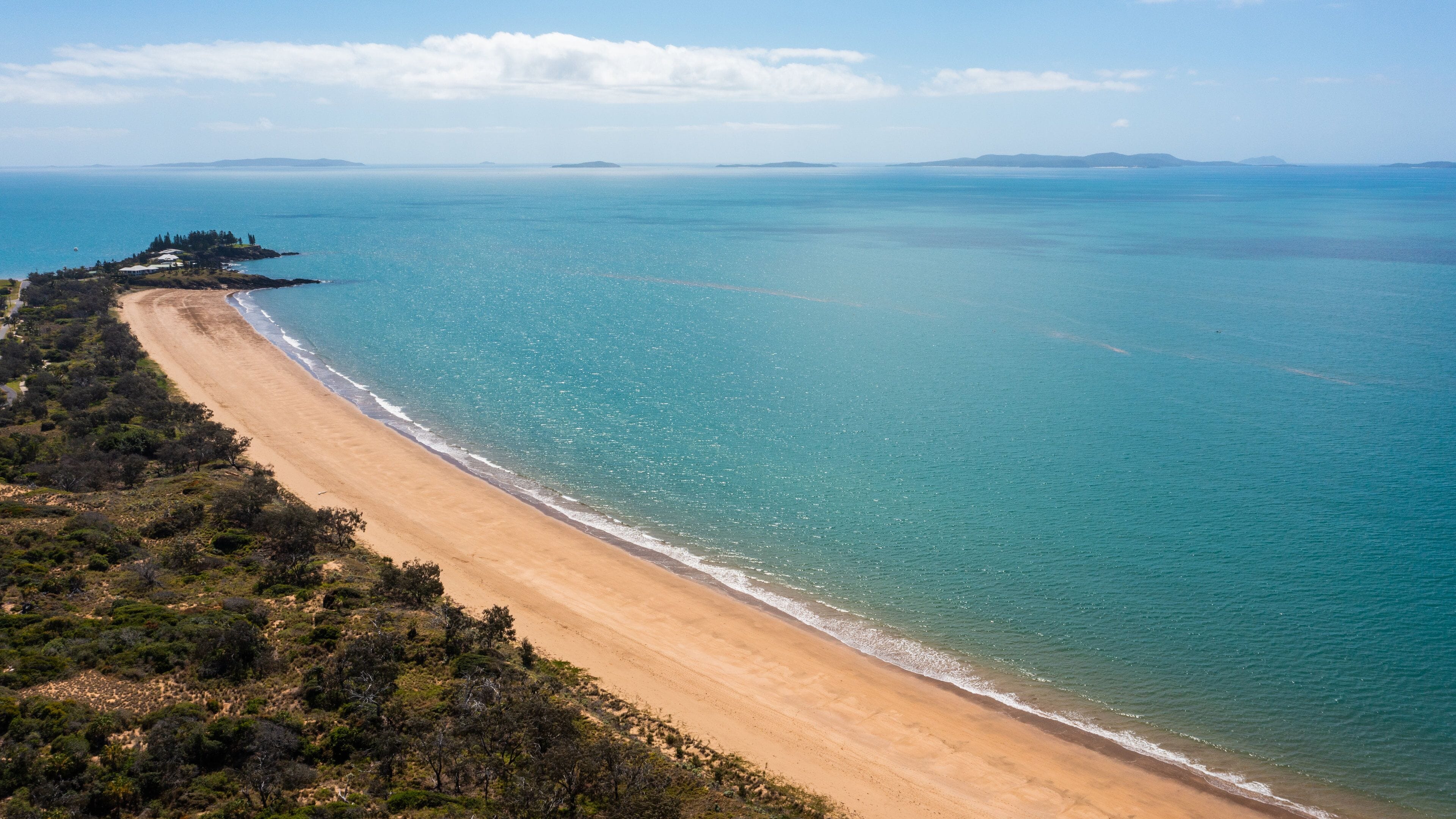 Emu Park Main Beach featuring landscape views, a sandy beach and general coastal views
