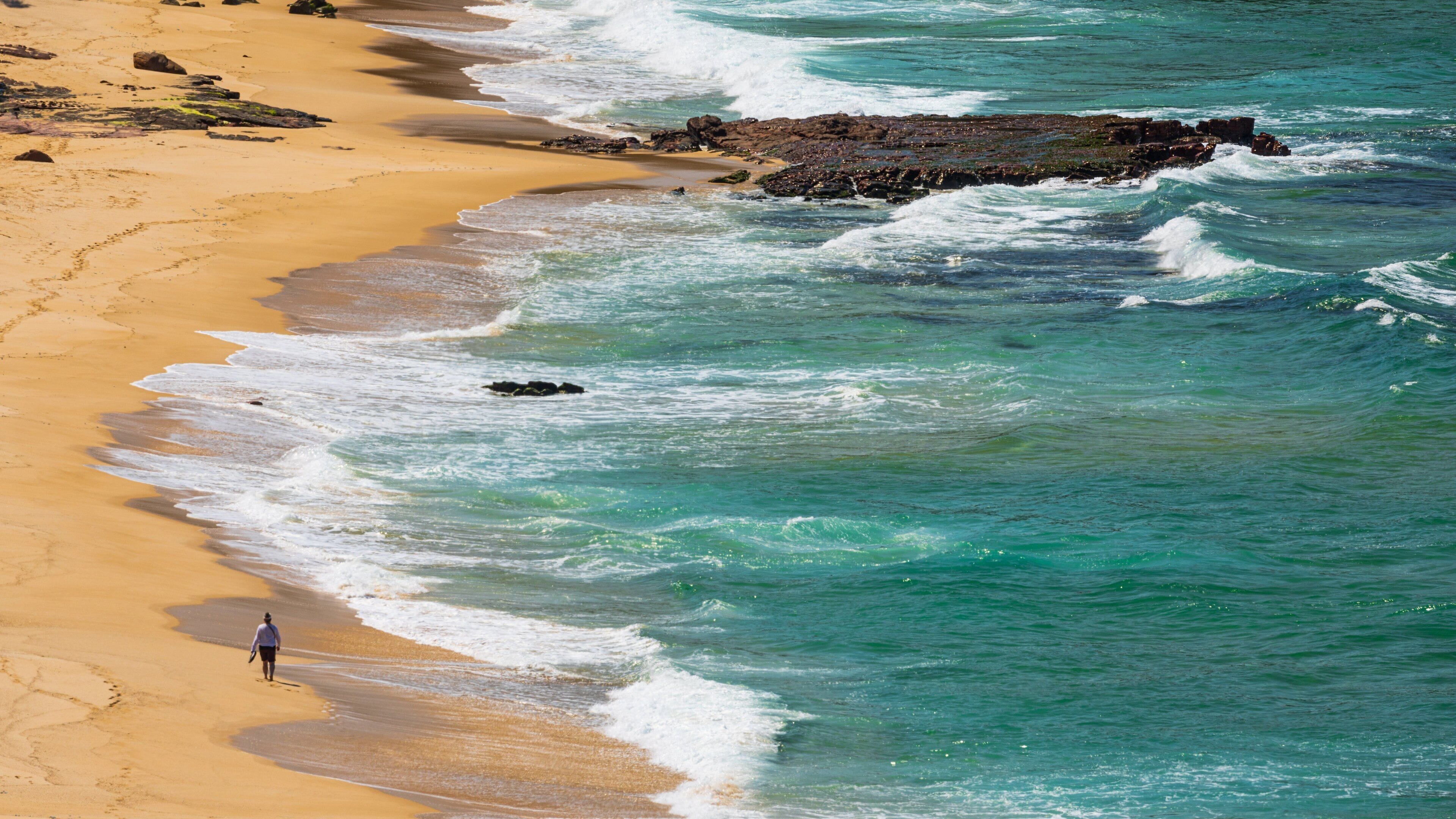 Middle Beach which includes rocky coastline, a beach and general coastal views