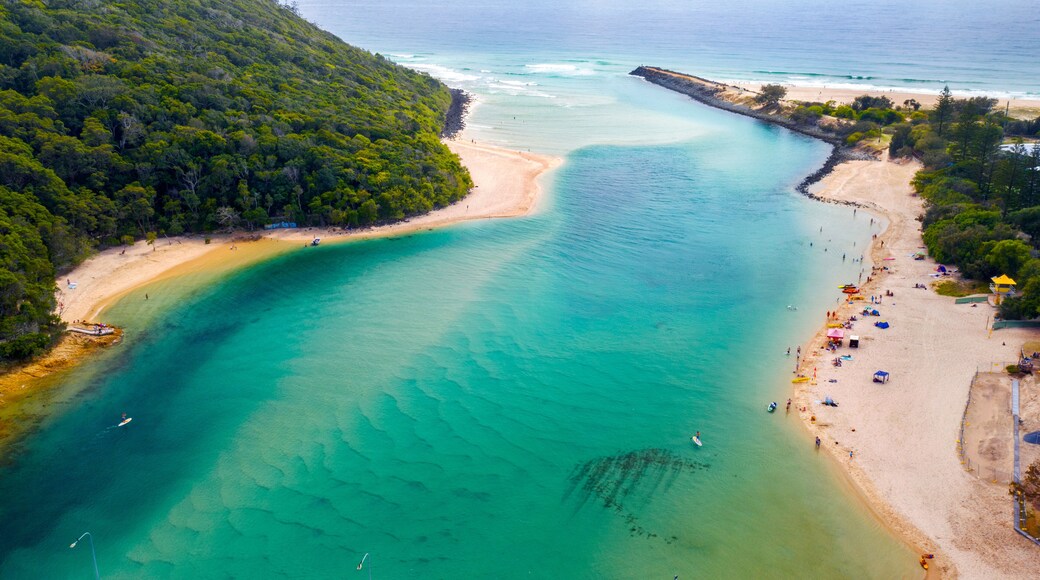 Aerial view over Tallebudgera creek Gold Coast, with swimmers on the beach