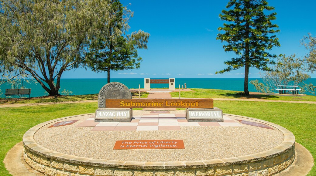 Elliot Heads Beach which includes signage and general coastal views