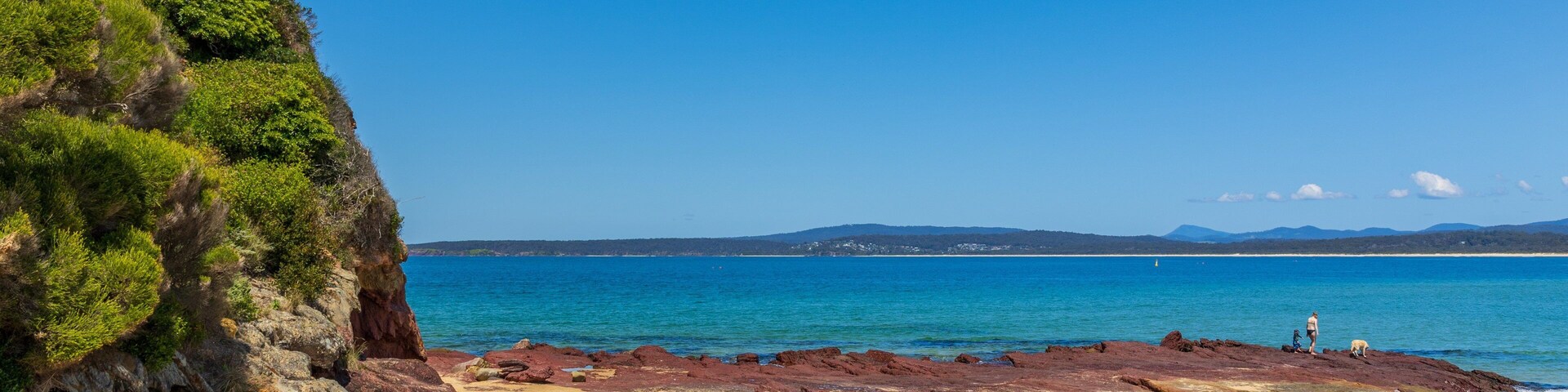Bar Beach which includes a beach, rocky coastline and general coastal views