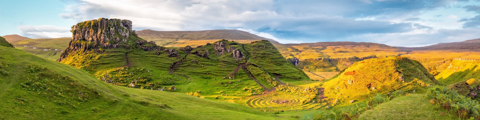 Panorama of famous mystic Fairy Glen at sunset, a green valley with romantic landscapes. Copy space in sky.
