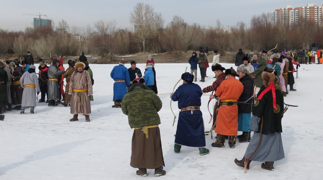 Ulaanbaatar was having its second winter festival on the frozen Tuul River. You see a lot of traditional deels in this photo, and they are having an archery competition. #snow