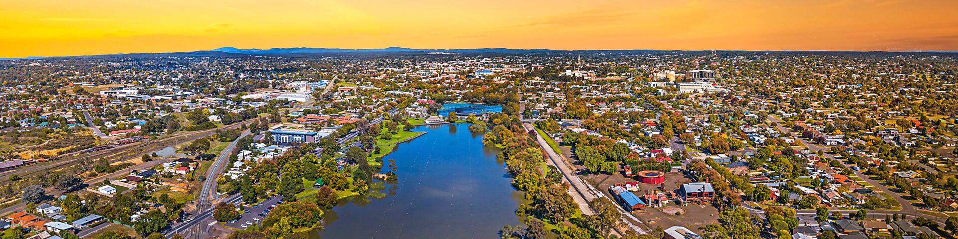Aerial view of Lake Weeroona Bendigo. Sunrise sunset morning evening flight with spectacular views of red purple and blue skies and the Central Victoria Australia landscape.