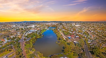 Aerial view of Lake Weeroona Bendigo. Sunrise sunset morning evening flight with spectacular views of red purple and blue skies and the Central Victoria Australia landscape.