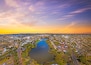 Aerial view of Lake Weeroona Bendigo. Sunrise sunset morning evening flight with spectacular views of red purple and blue skies and the Central Victoria Australia landscape.
