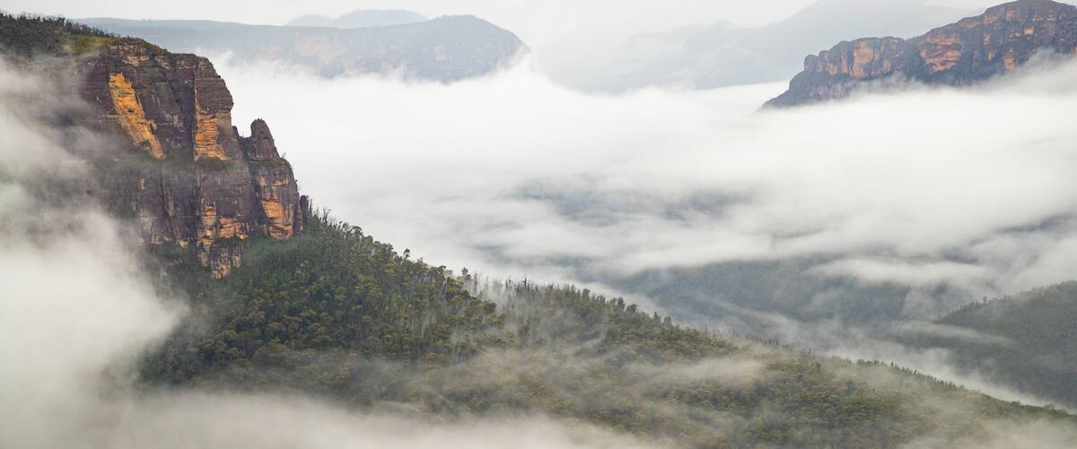Govetts Leap lookout which includes mist or fog, landscape views and a gorge or canyon