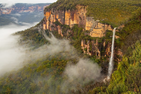 Govetts Leap lookout featuring a cascade, landscape views and mist or fog