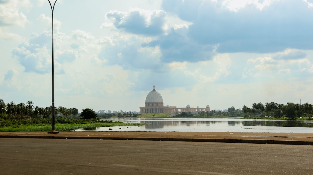 Stunning view of Basilica of Our Lady of Peace reflecting in lake Yamoussoukro Ivory Coast