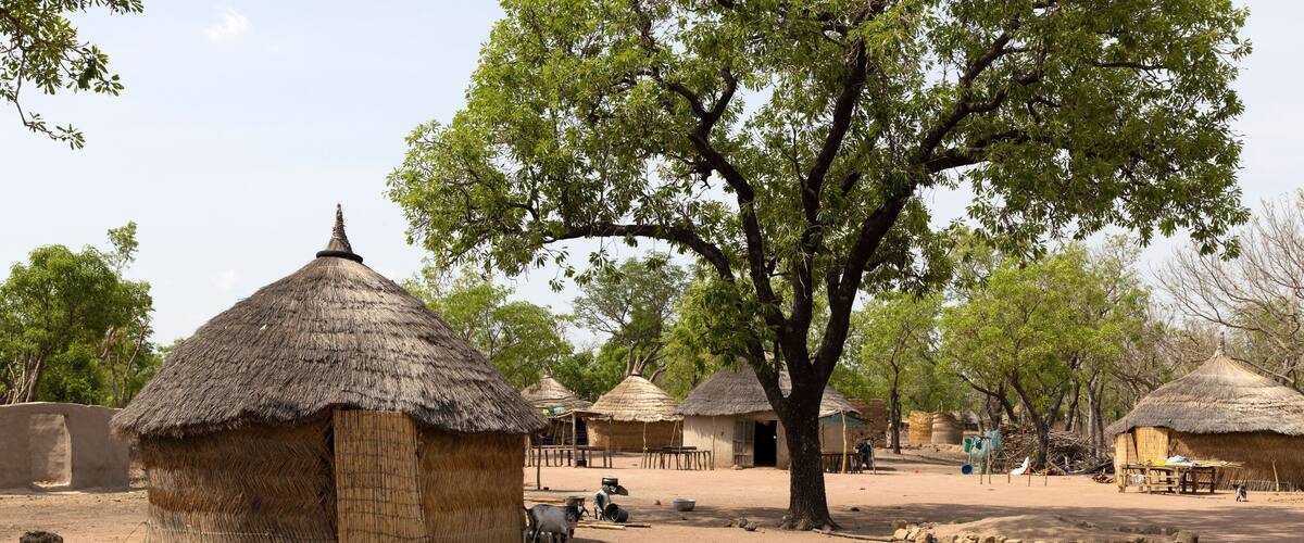 Traditional northern Ghana grass hut bush village Africa. Northern region of Ghana. Rural traditional mud and straw huts and buildings. Poverty economy. African tribal and native homes.