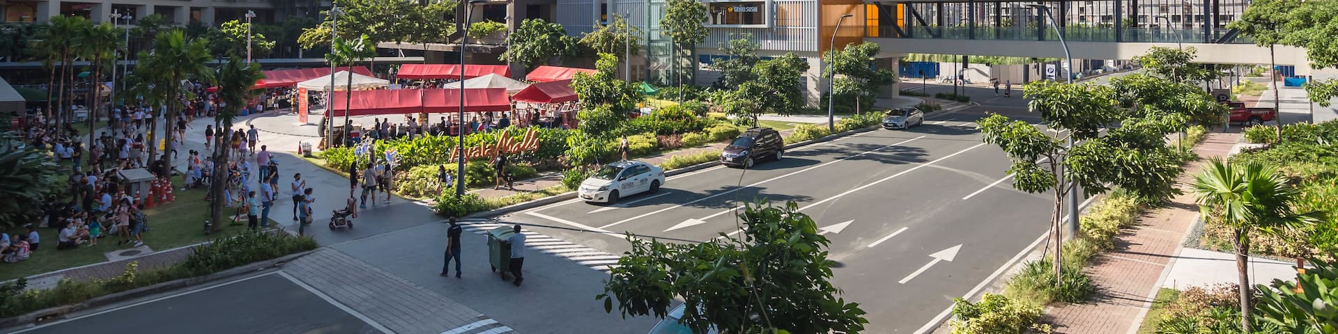 Paranaque, Metro Manila, Philippines - Ayala Malls Manila Bay, a large shopping center. An avenue passes through the mall's courtyard.