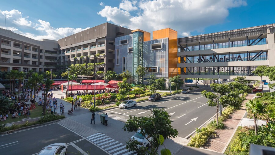 Paranaque, Metro Manila, Philippines - Ayala Malls Manila Bay, a large shopping center. An avenue passes through the mall's courtyard.